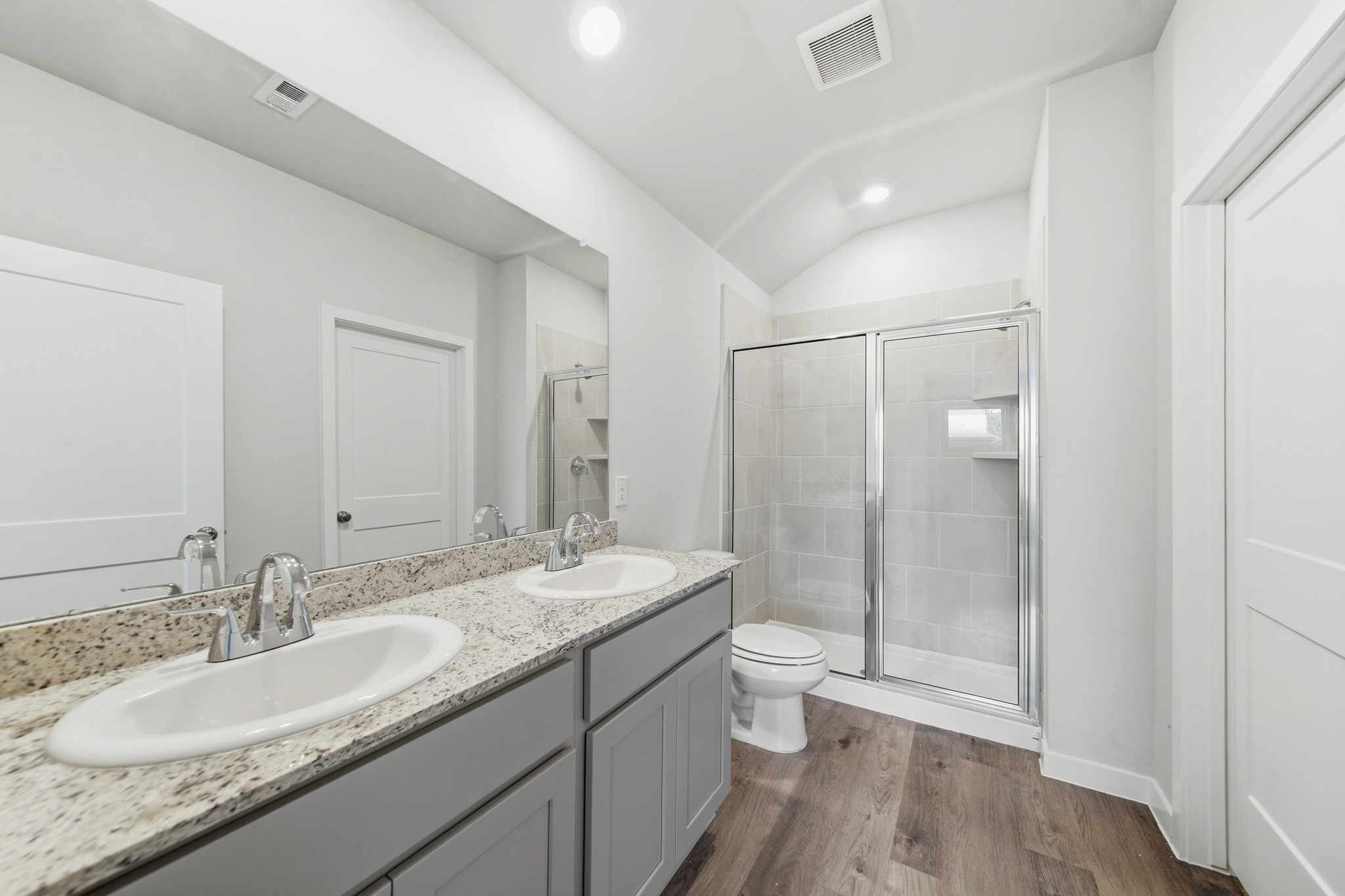 A bathroom with a glass shower.