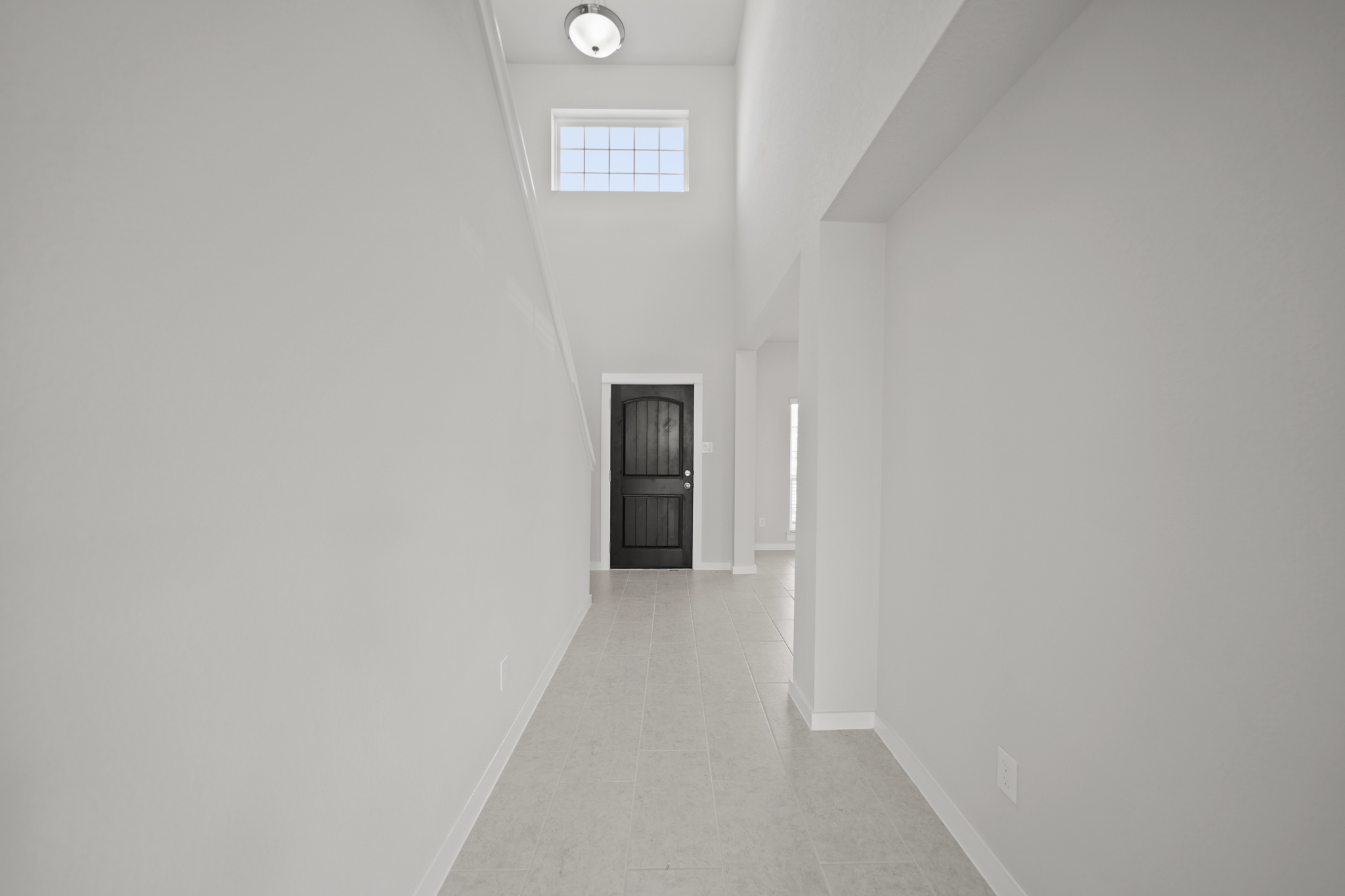 A hallway with white walls.