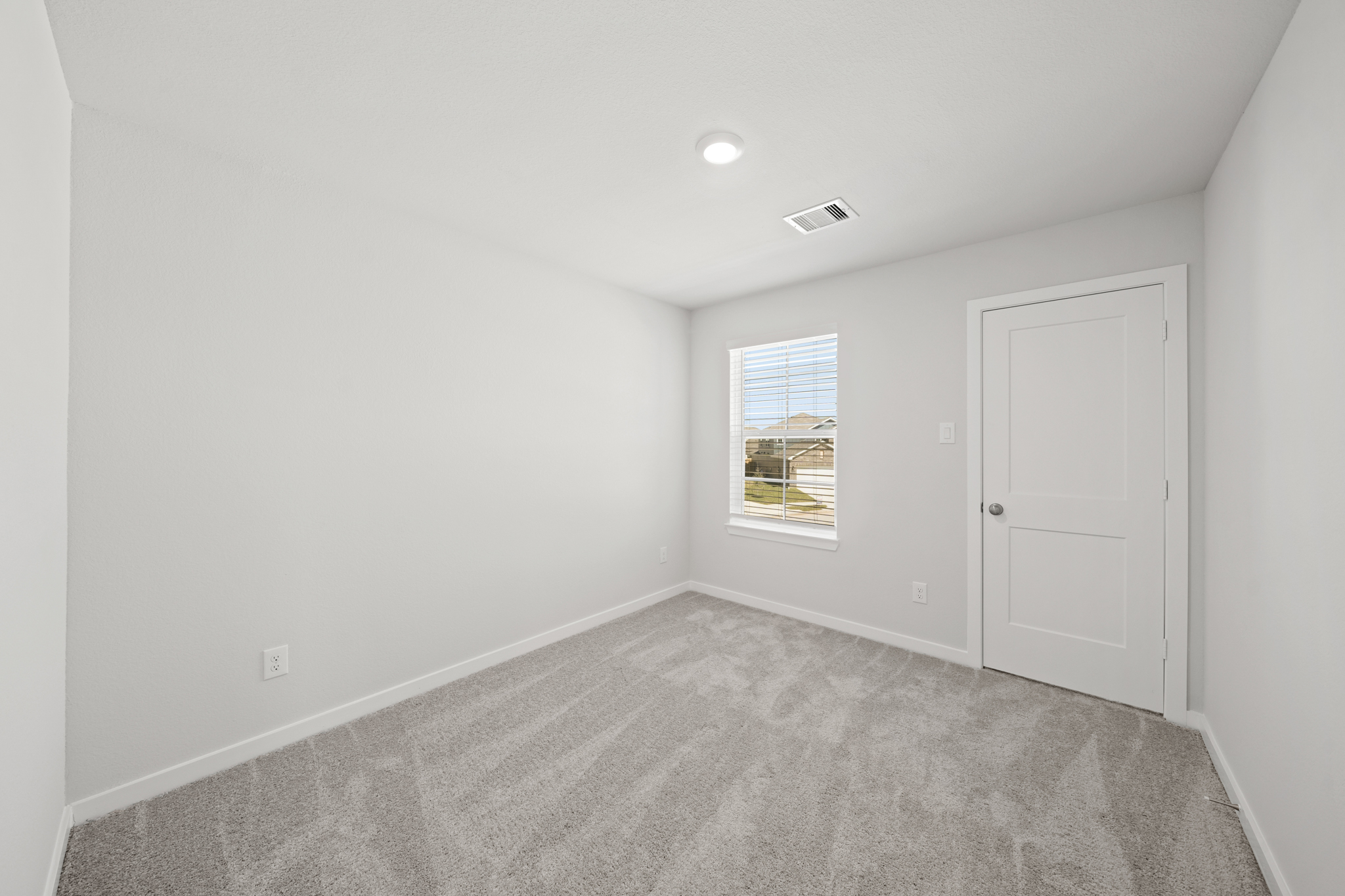 A room with a door and a window.