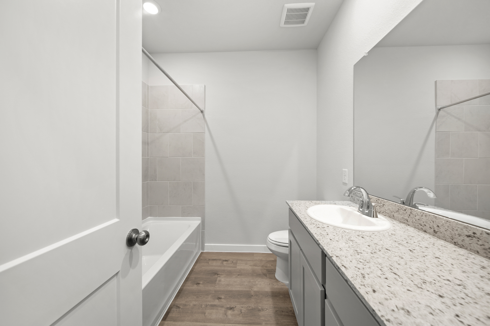 A bathroom with a marble countertop.
