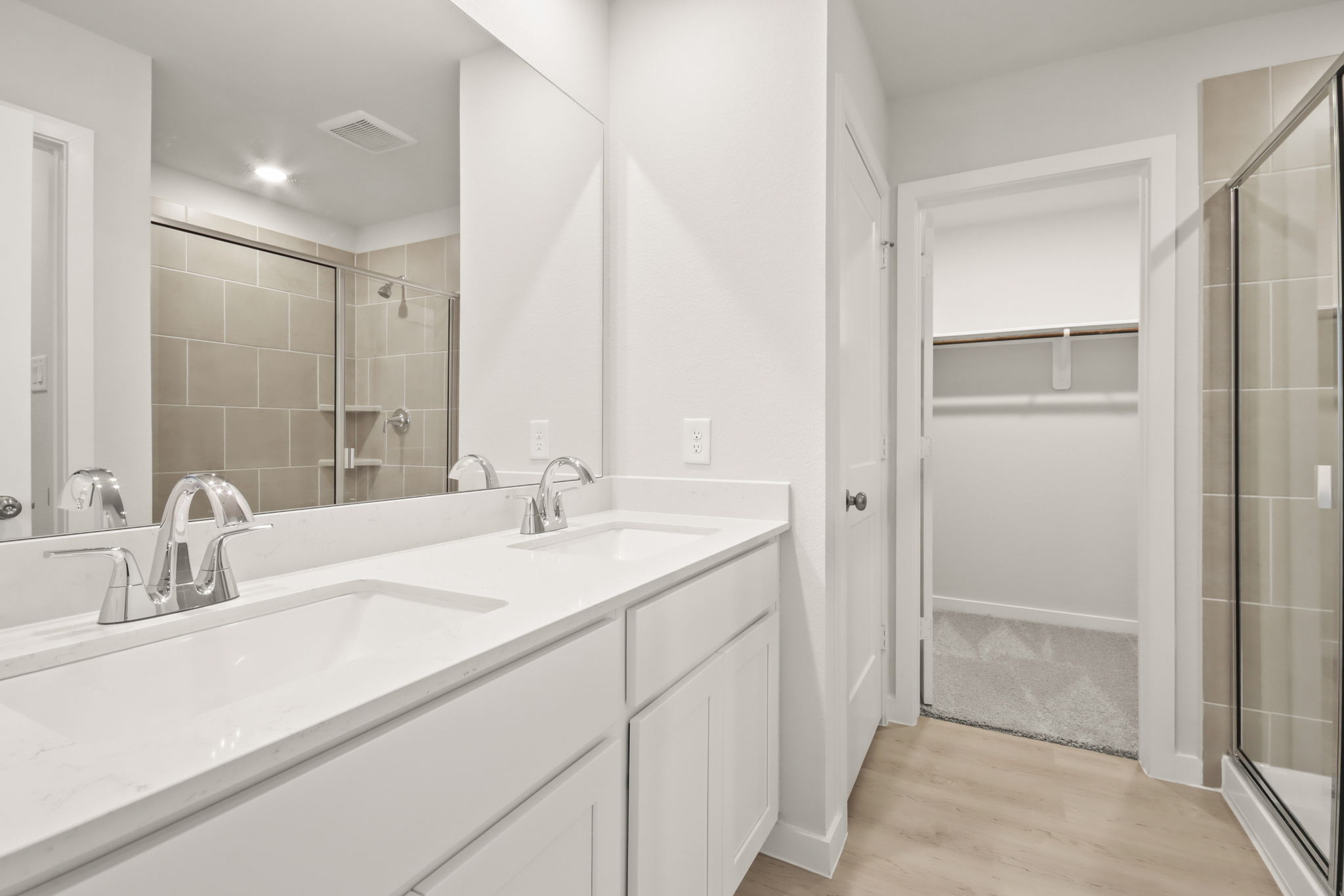 A bathroom with a glass shower.