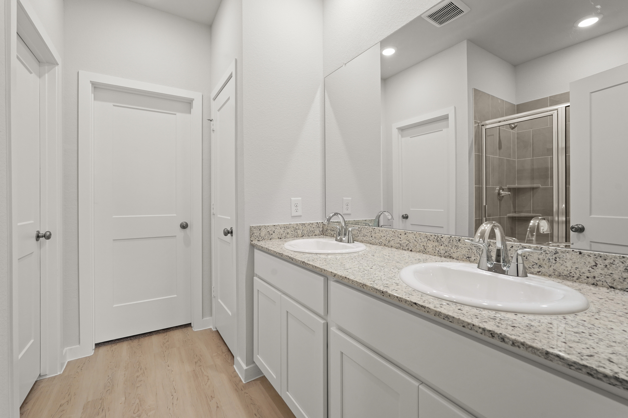 A bathroom with a marble countertop.