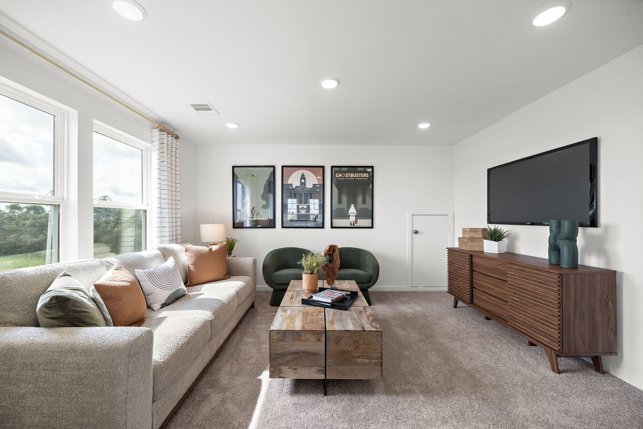 A living room with a tv and couches.