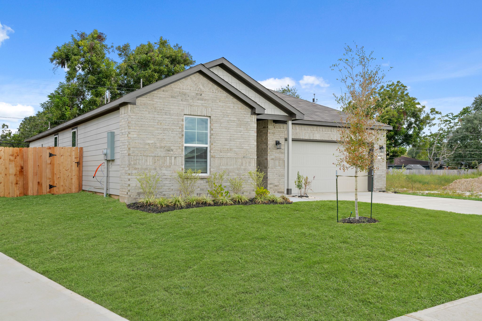A house with a yard and trees.