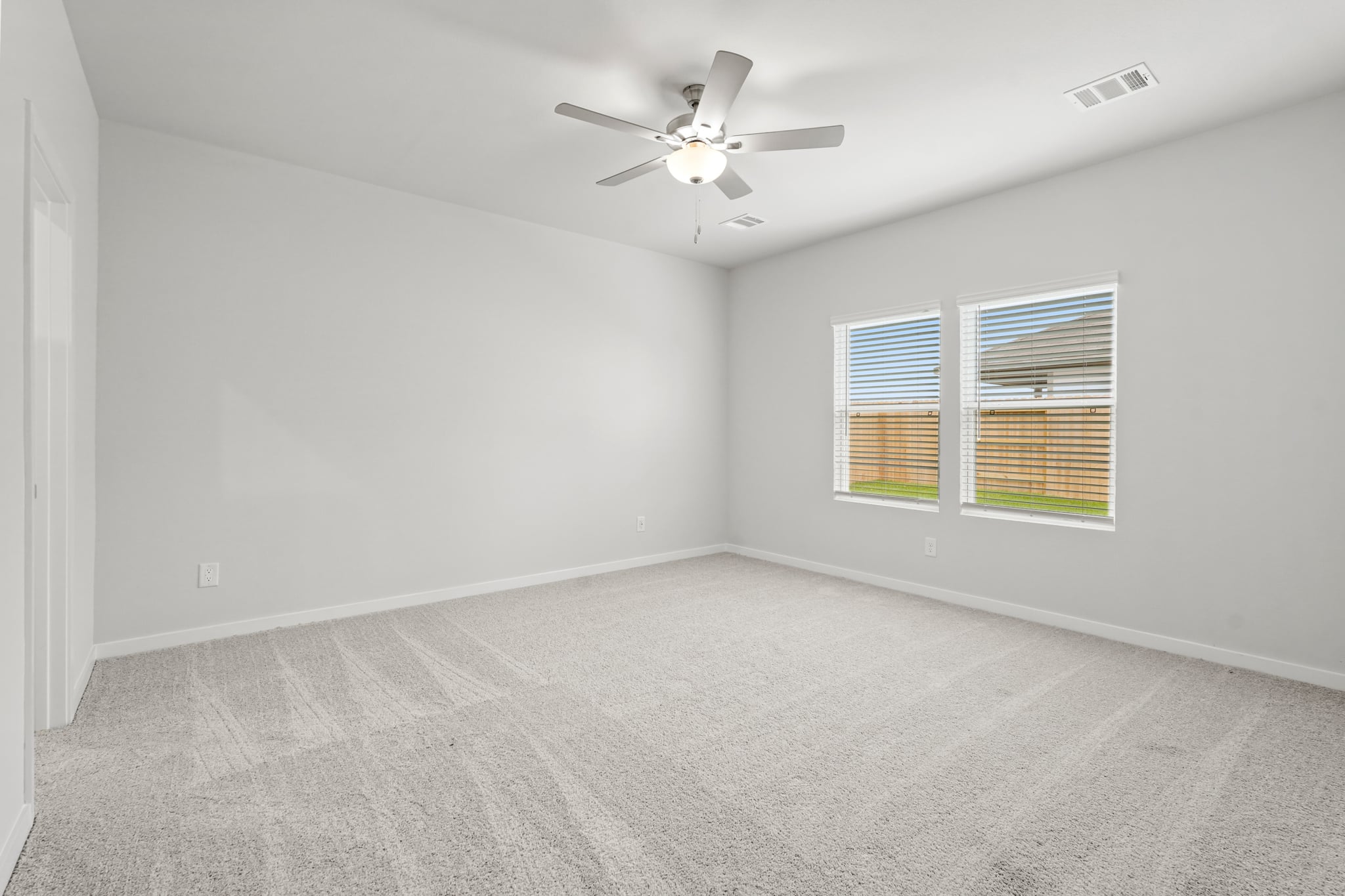 A ceiling fan in a room.