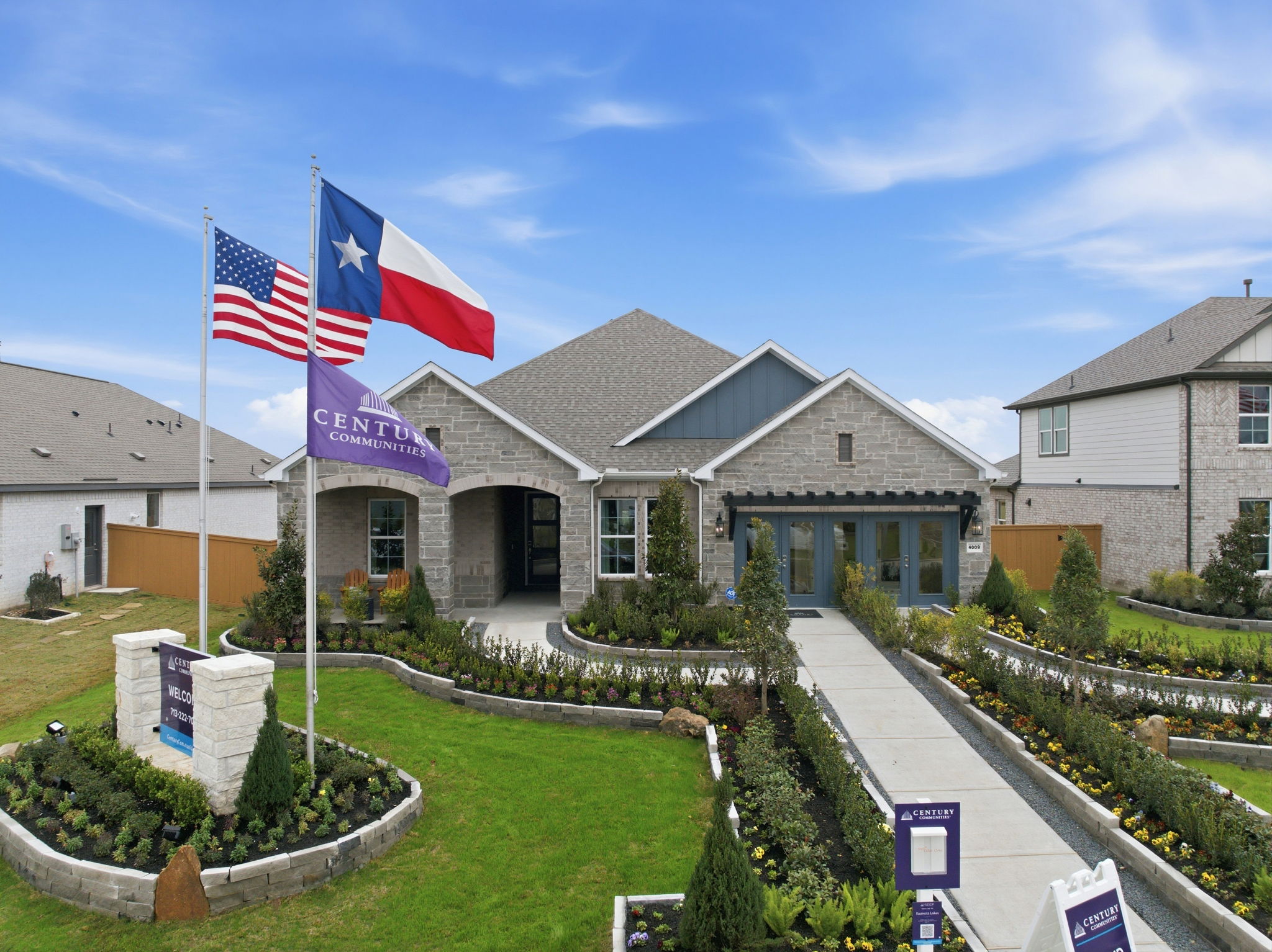 A row of houses with flags.