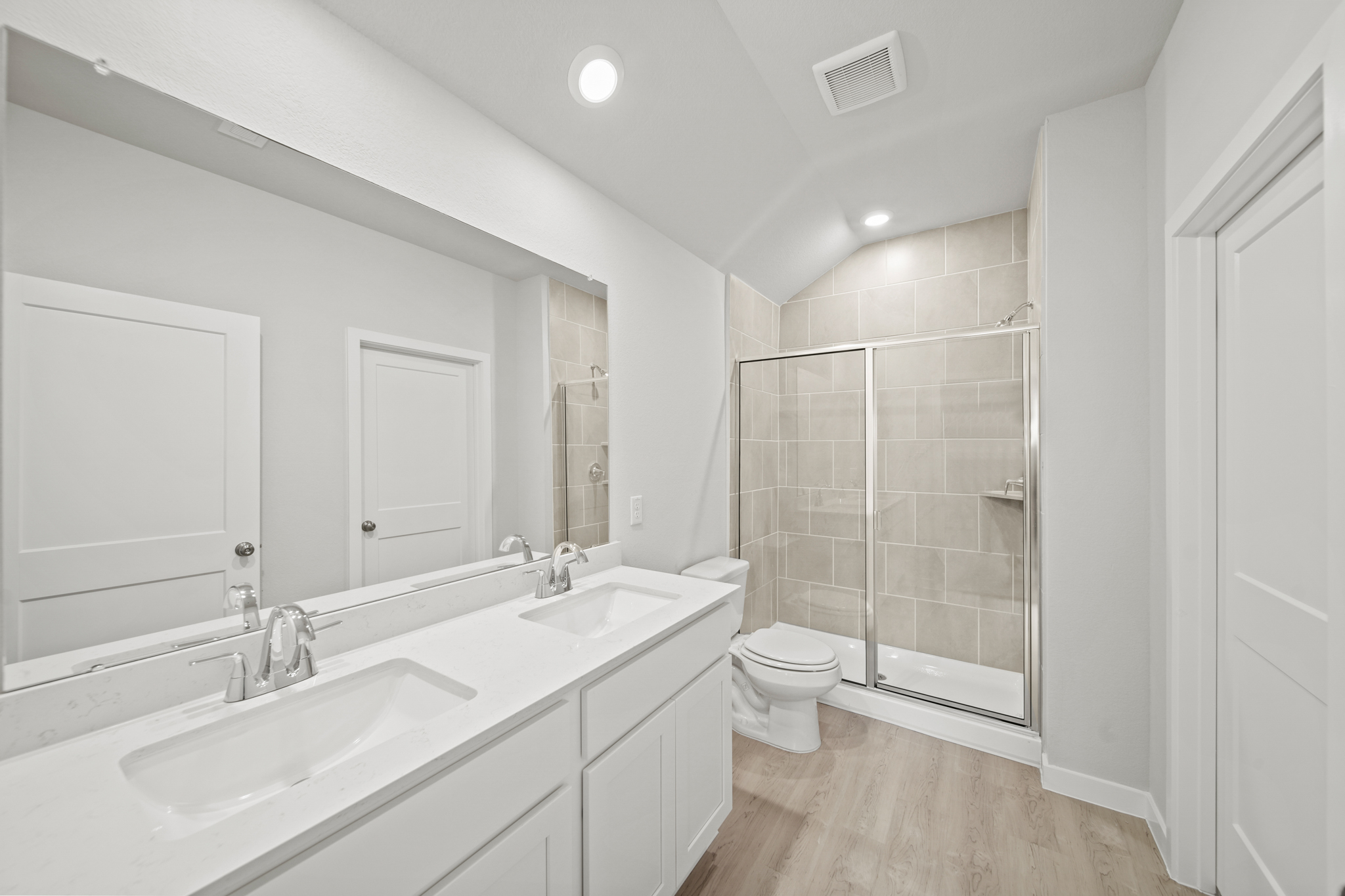 A bathroom with a glass shower.