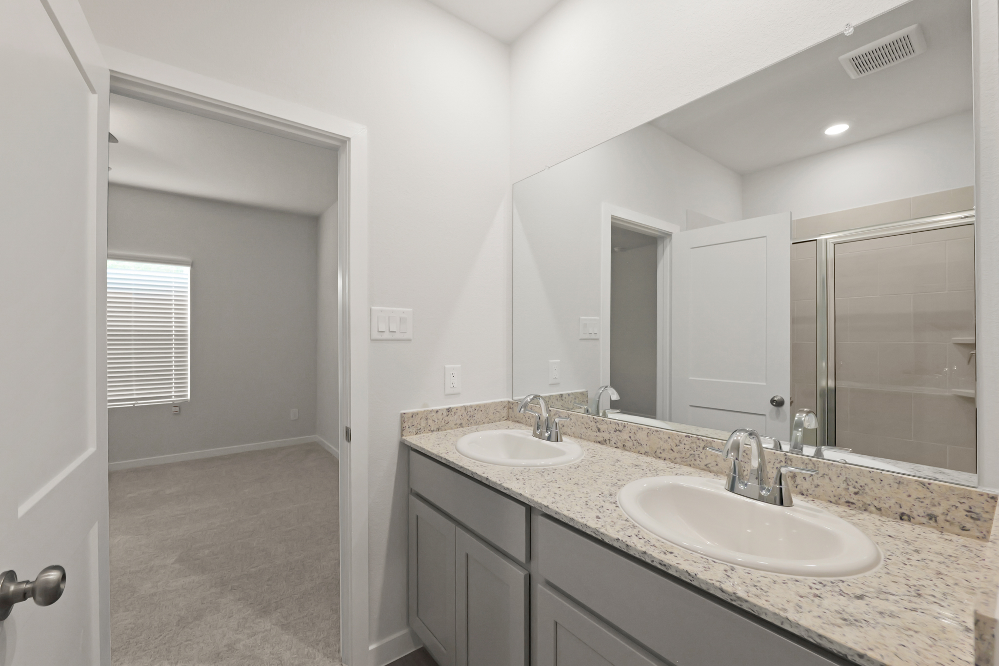 A bathroom with two sinks.