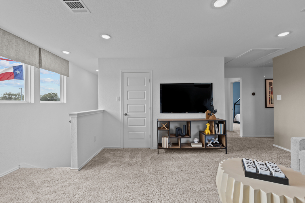 A living room with a tv and a couch.