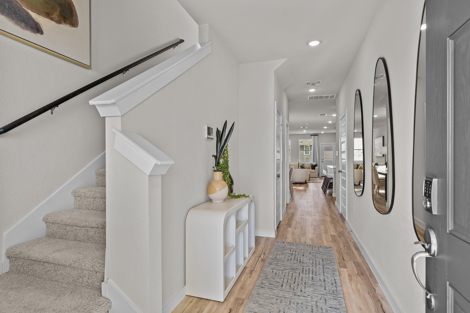 A hallway with white walls.
