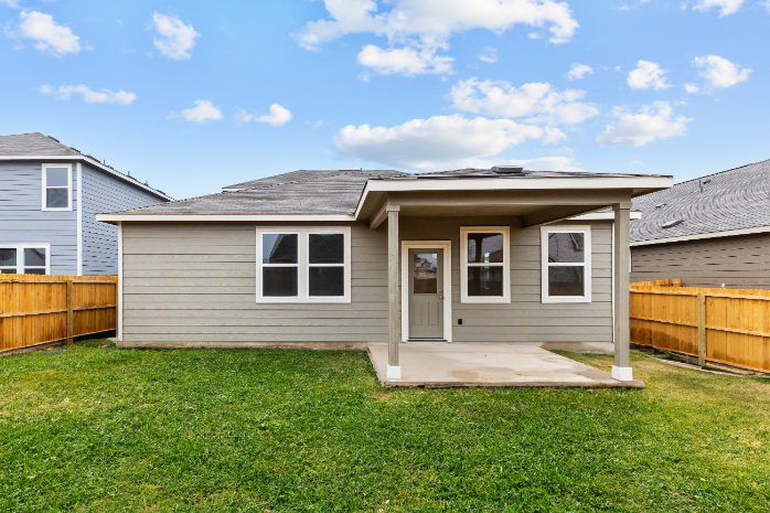 A small house with a fence.