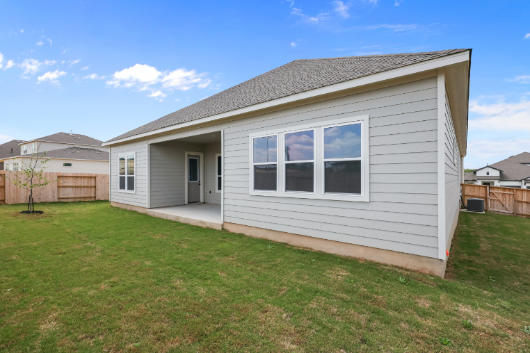 A house with a grass yard.