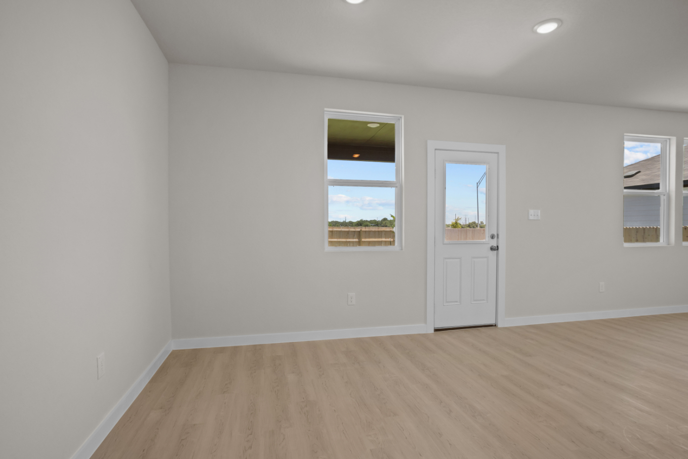 A room with white walls and windows.