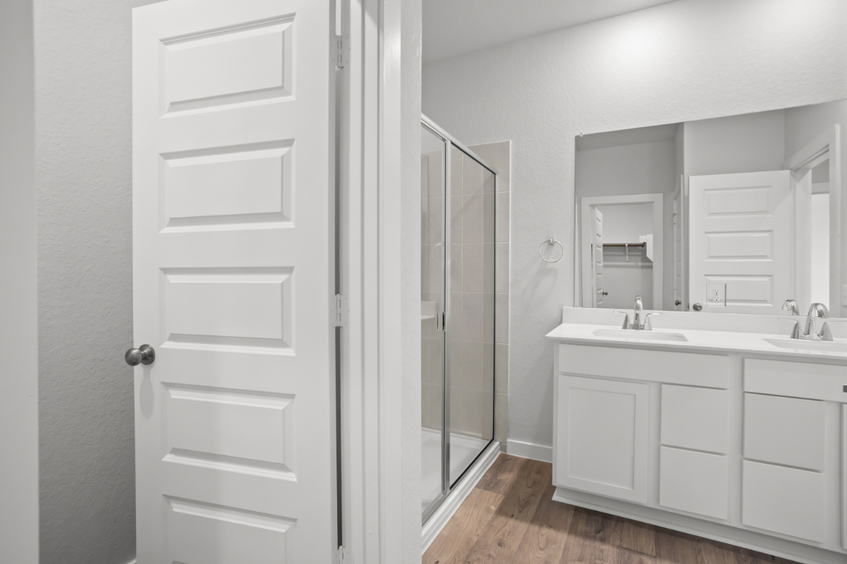 A bathroom with a glass shower.