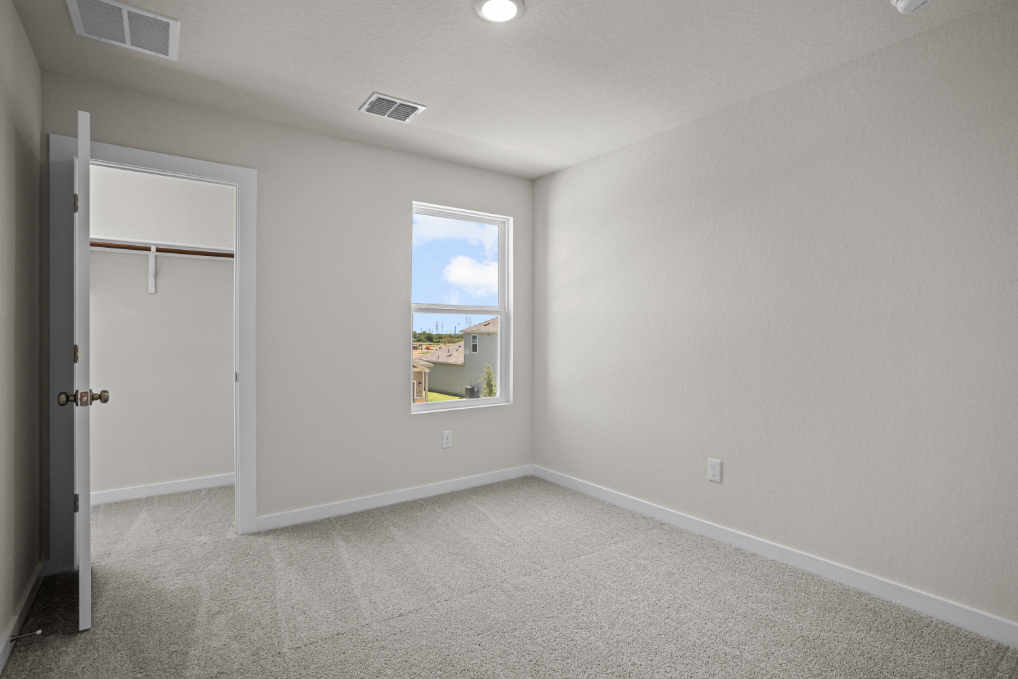 A room with a window and a door.