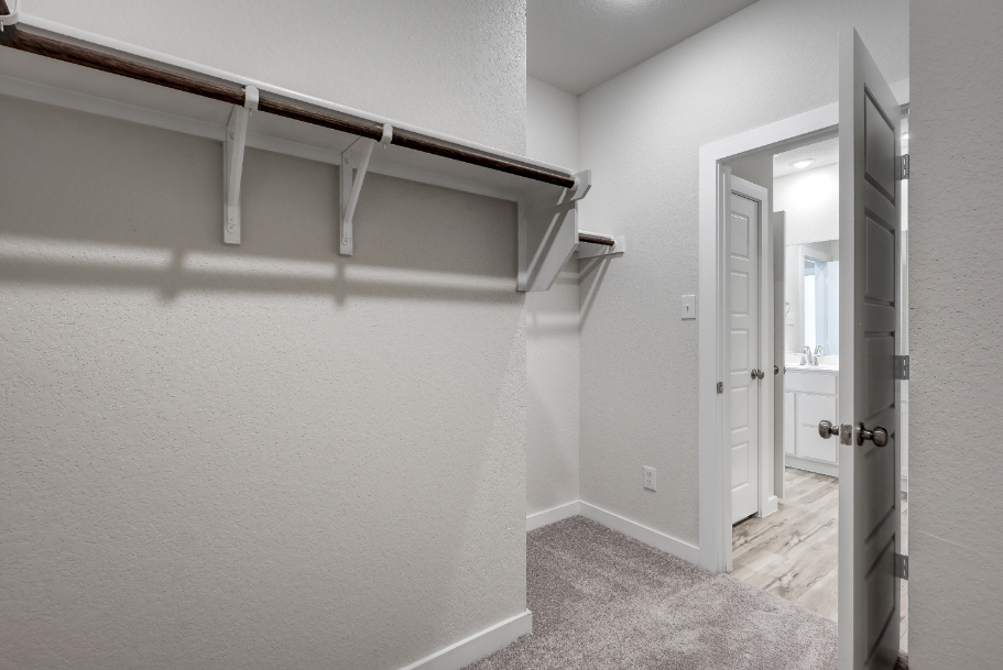 A hallway with white walls.