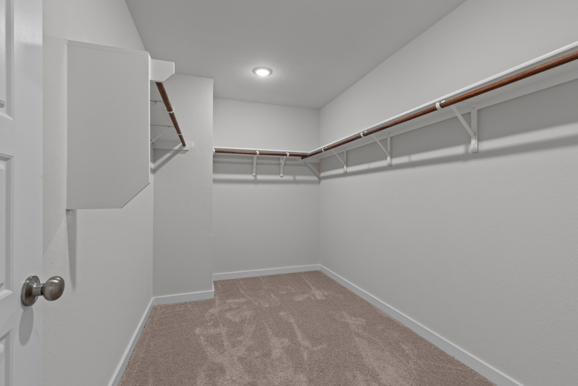 A hallway with white walls.