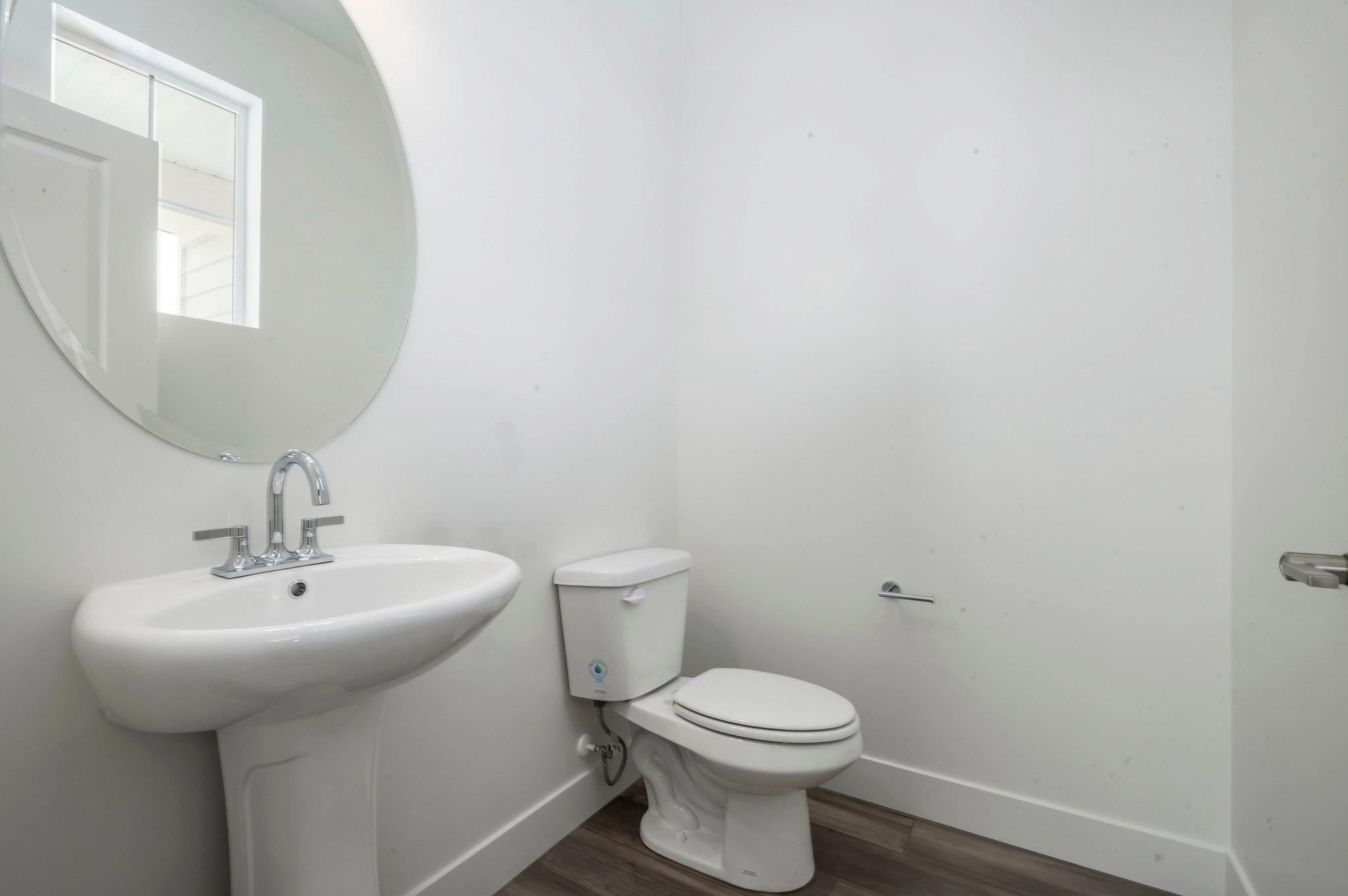 A bathroom with a toilet and sink.