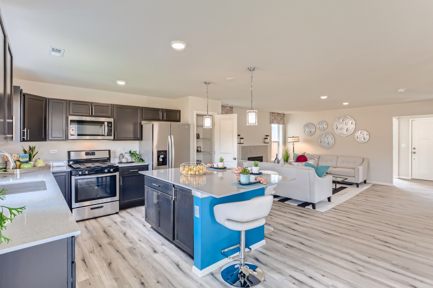 A kitchen with a bar and a table.