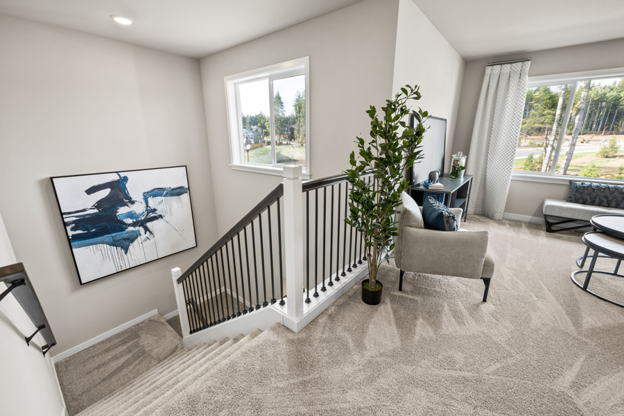 A living room with a staircase.