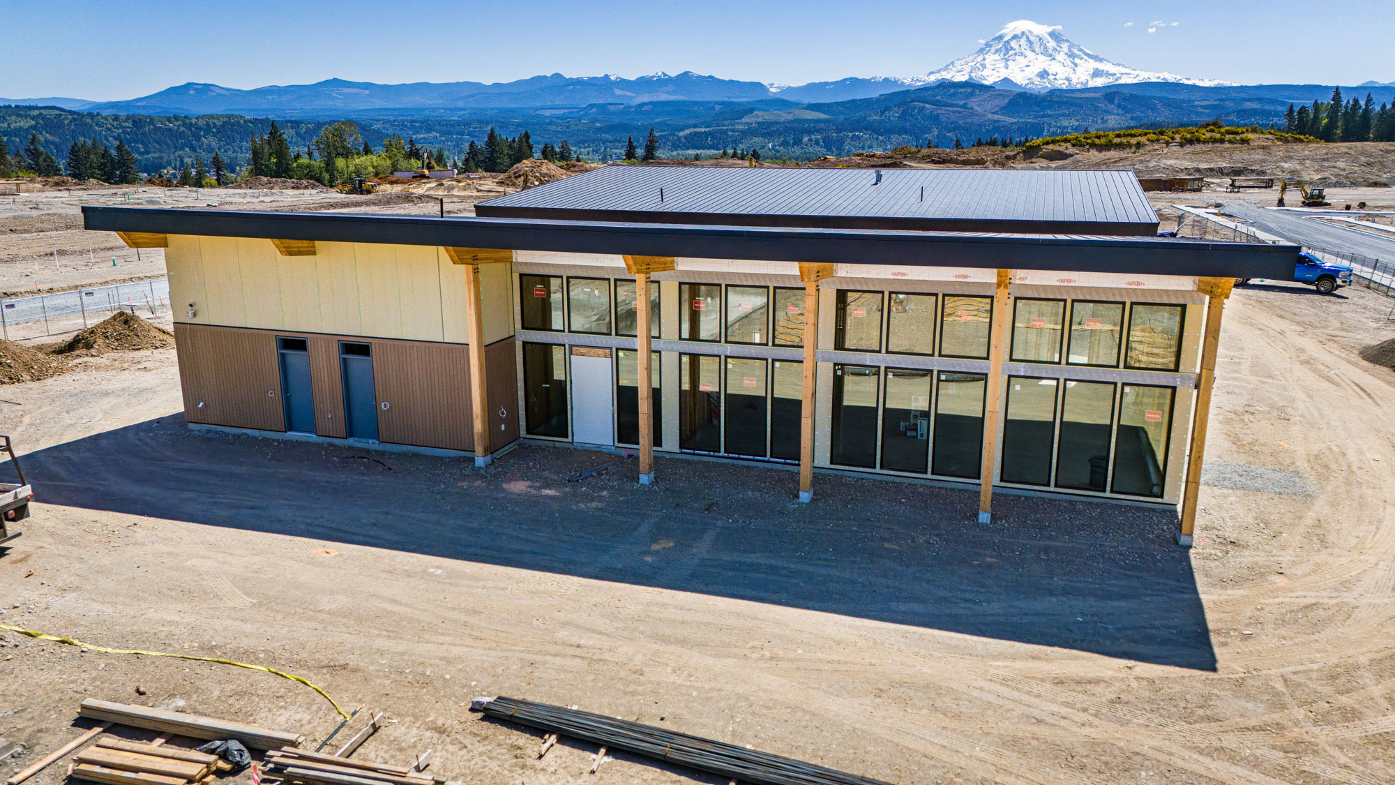 A building with a snowy mountain in the background.