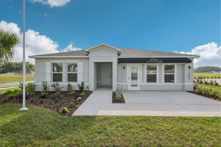 A white house with a driveway.