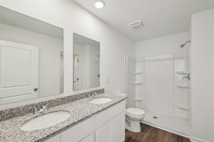 A bathroom with a marble countertop.