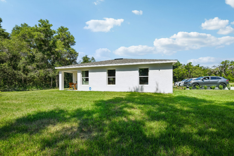 A white house with a garage.