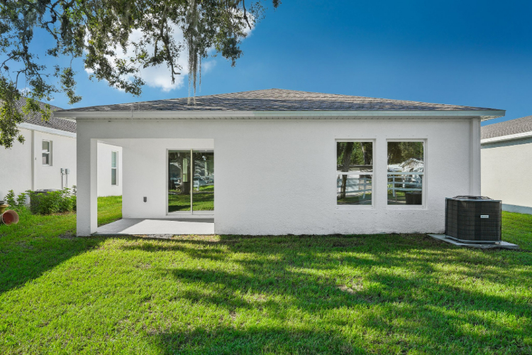 A house with a grass yard.