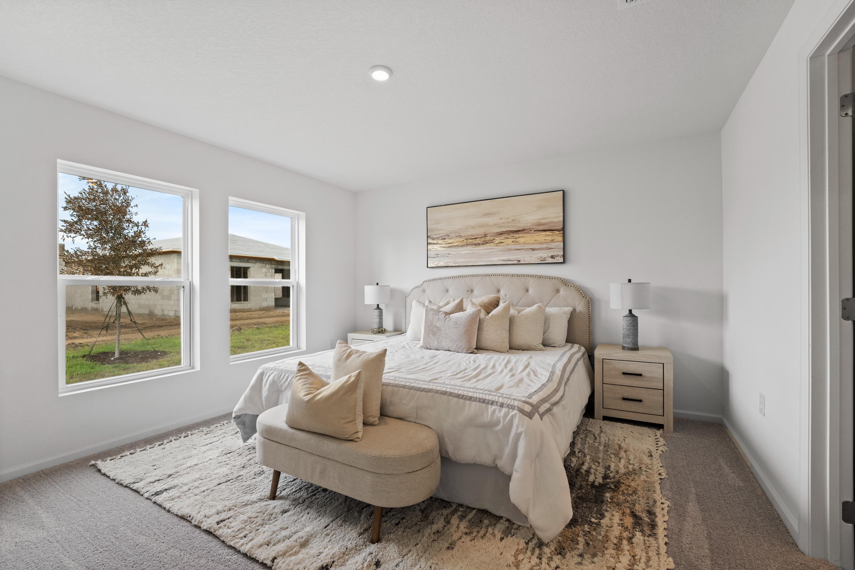 A bedroom with a bed and a couch.