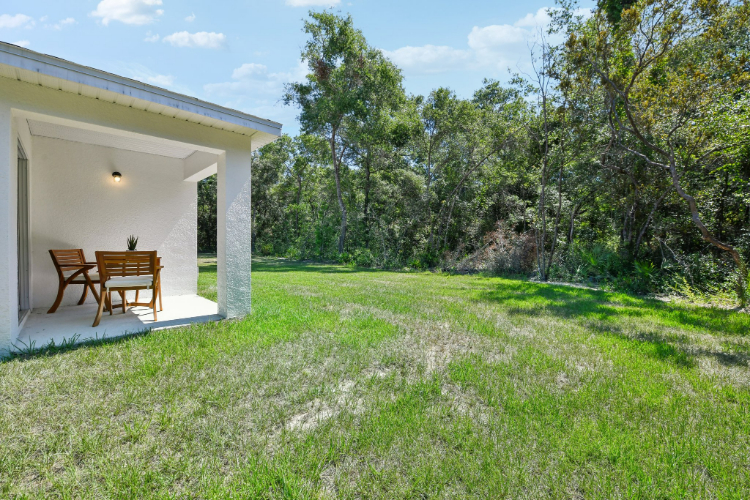A house with a lawn and trees.