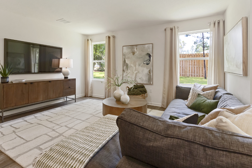 A living room with a couch and a table.