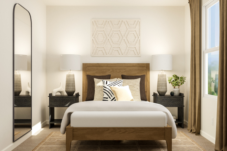 A bed with a white bed spread.